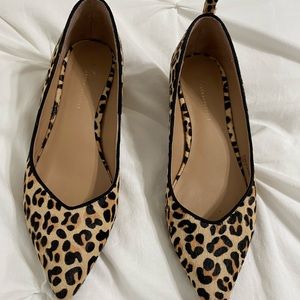 By Anthropologie Calf hair, wood block heels from Anthropologie.